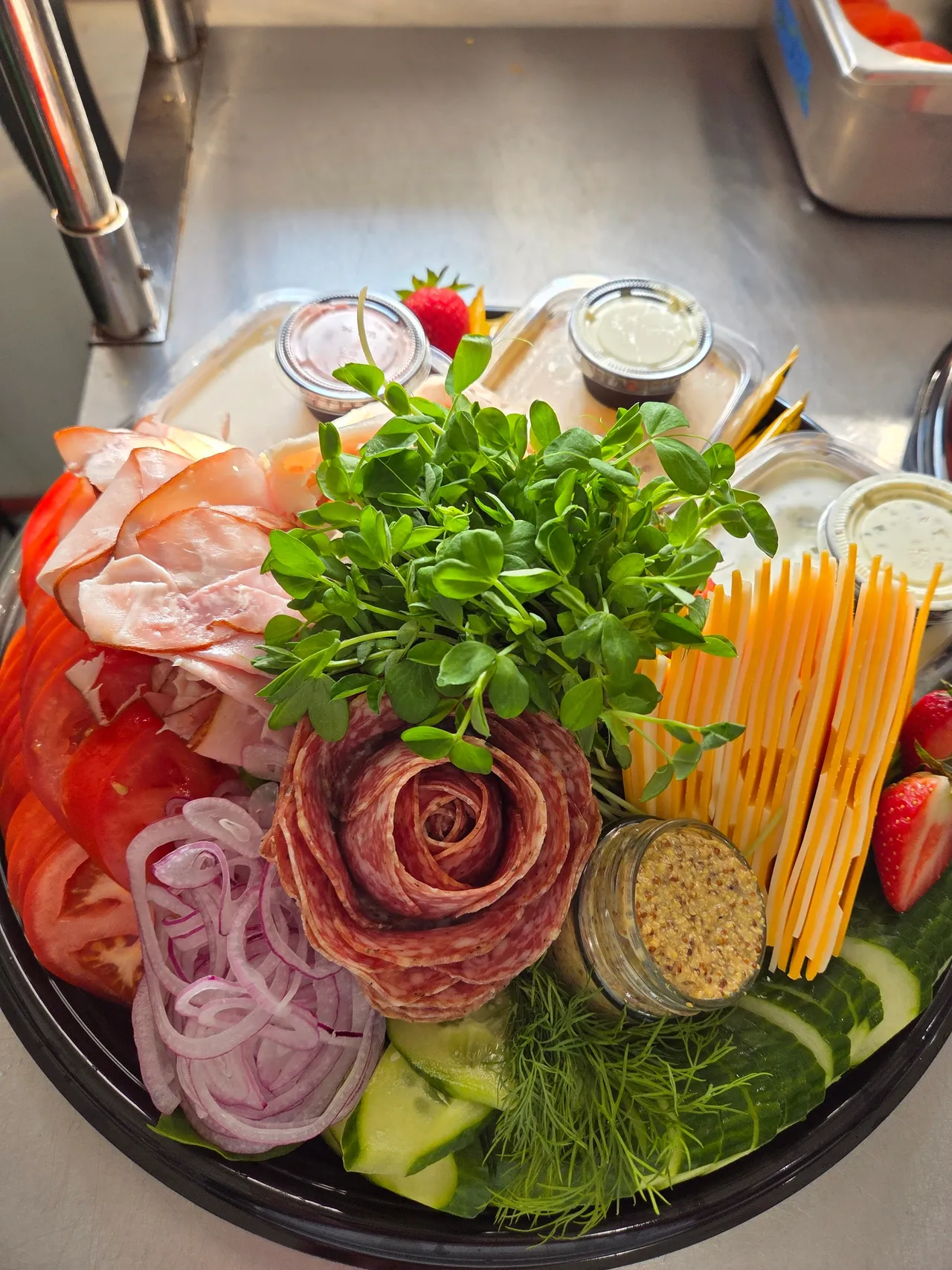 Brunch board detail — salami rose, cheddar sticks, microgreens and grainy mustard